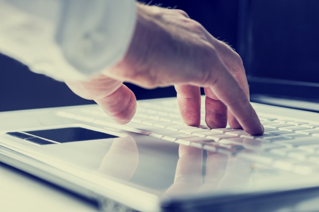 Man Typing on Laptop - iStock_000037002590_Medium